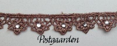 Gammel rosa bånd med sten